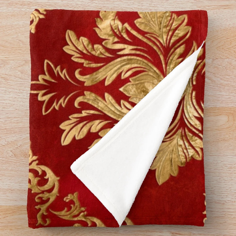 Vintage damask patterned plush blanket in red and gold colors