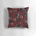 Dark red roses in a lush, botanical midnight garden printed on a soft, cozy pillow