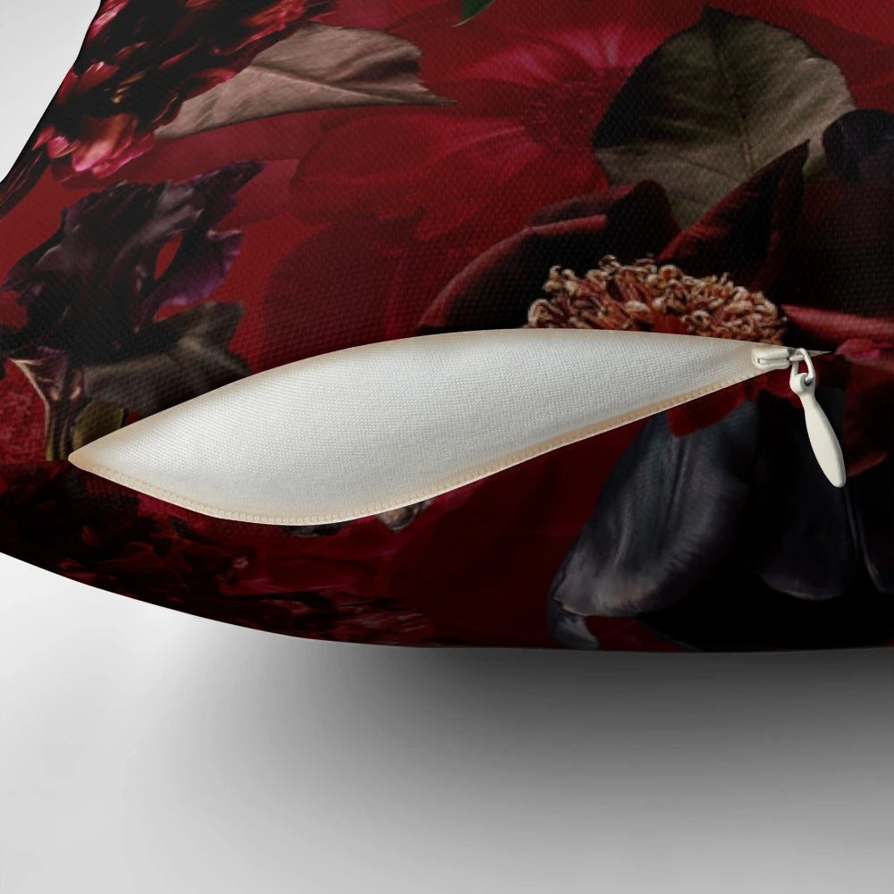 Dark red roses in a lush, botanical midnight garden printed on a soft, cozy pillow