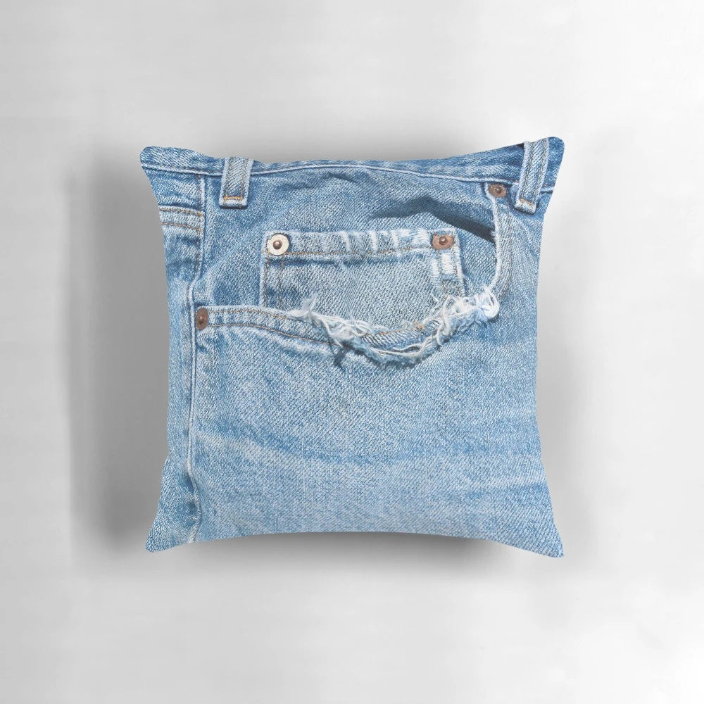 Vintage denim pillow with a distressed old blue jeans design
