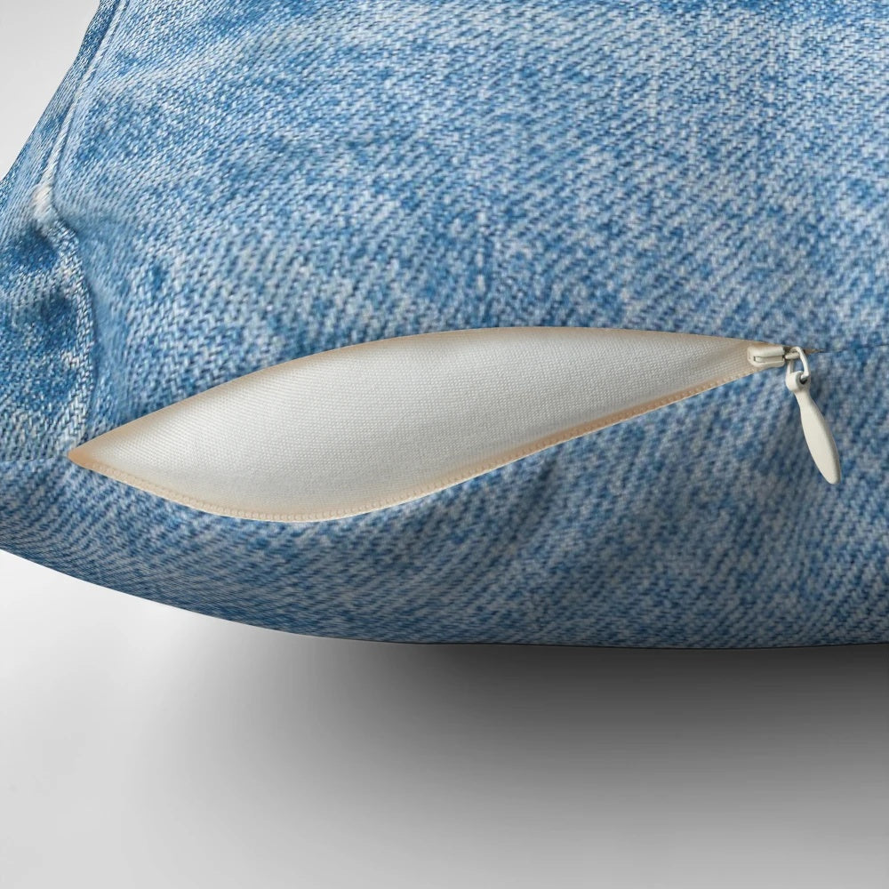 Vintage denim pillow with a distressed old blue jeans design