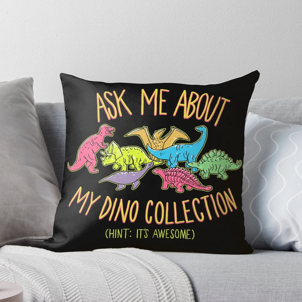 A soft, plush pillow featuring a colorful, retro-style design of various dinosaur species.