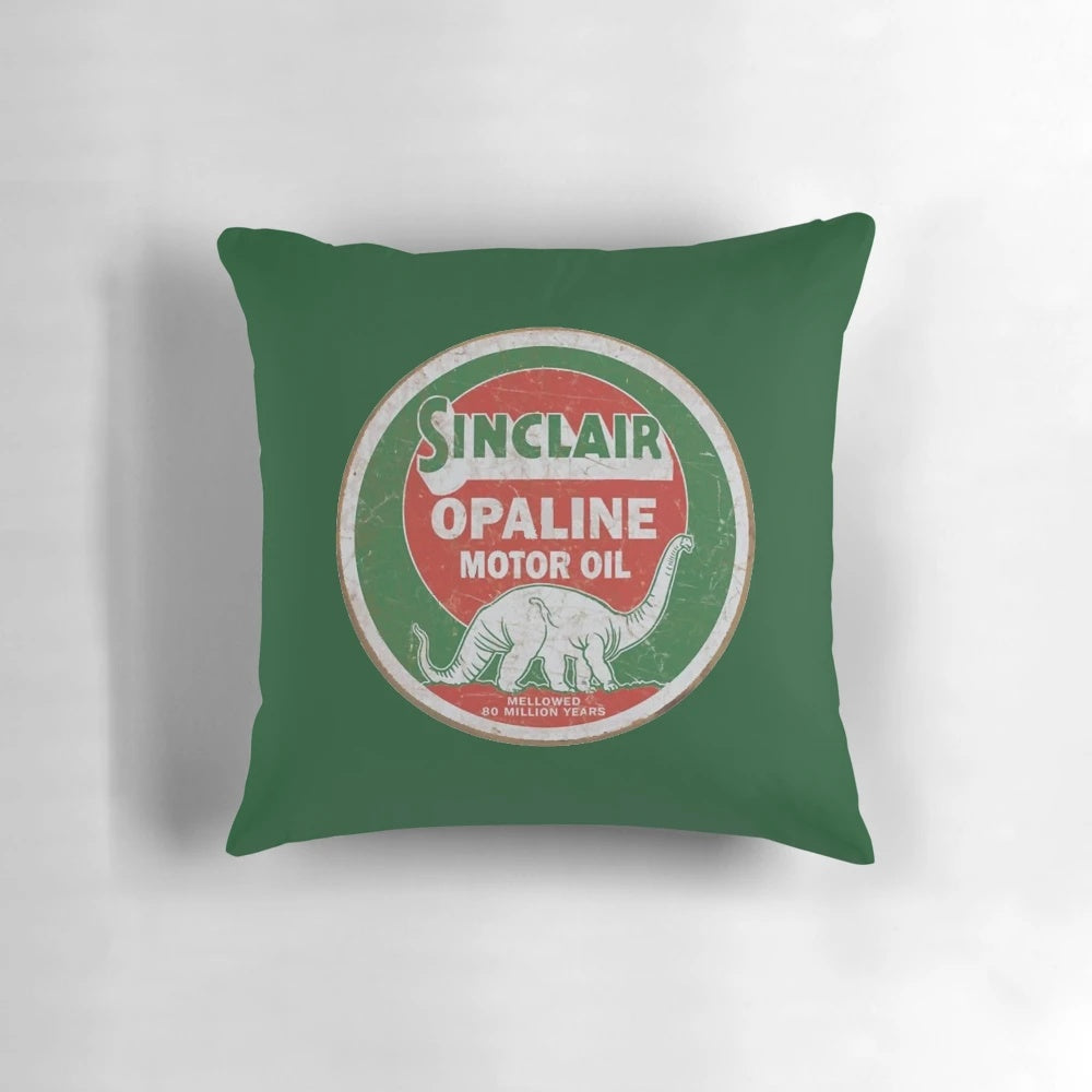 Vintage distressed Sinclair Dino motor oil symbol on a throw pillow