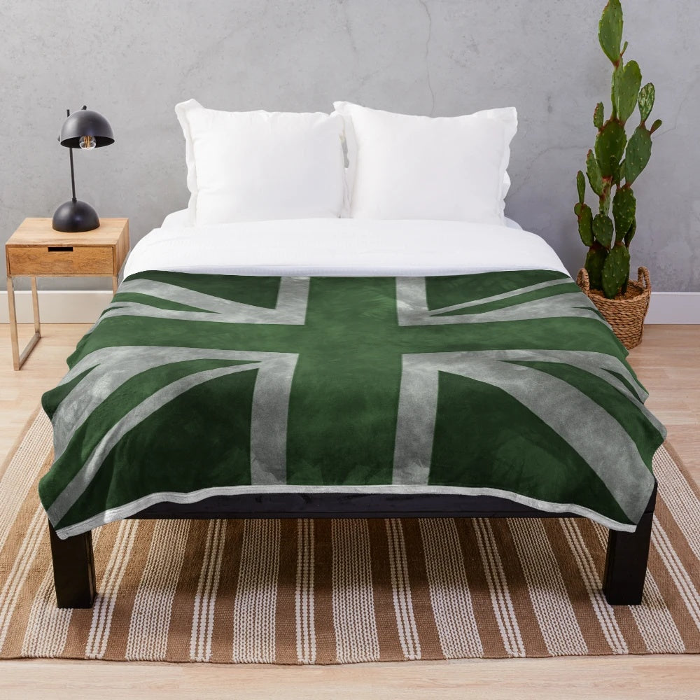 Distressed Union Jack flag pattern on a green plush blanket