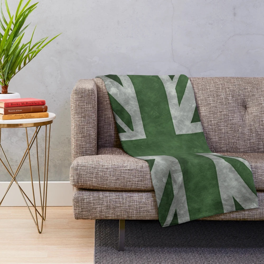 Distressed Union Jack flag pattern on a green plush blanket