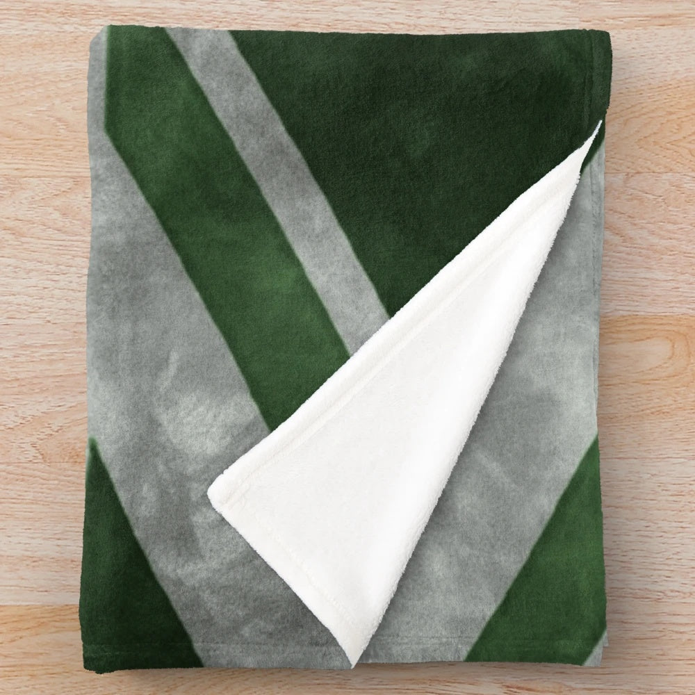 Distressed Union Jack flag pattern on a green plush blanket