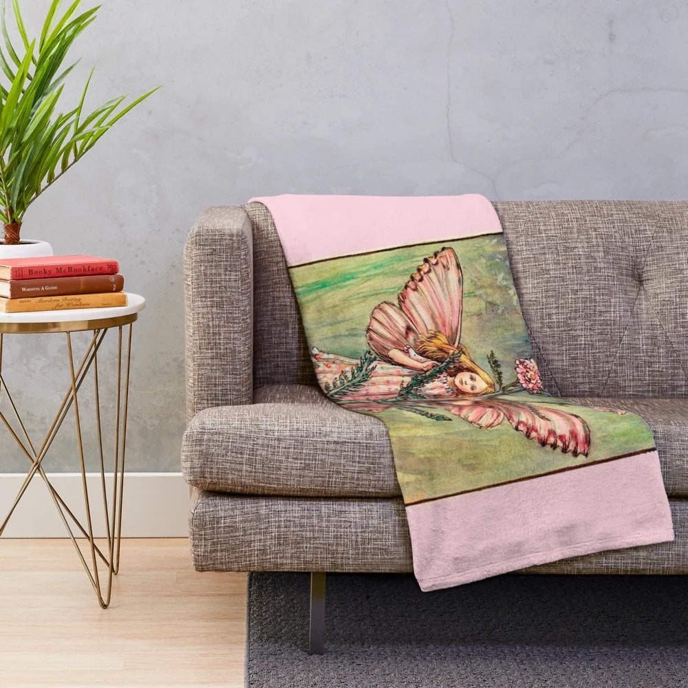 Vintage illustration of The Yarrow Fairy on a plush, cozy blanket