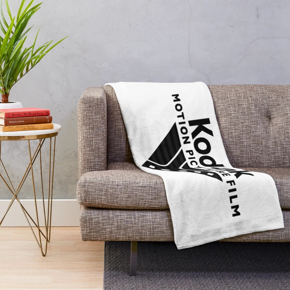 Vintage film-inspired plush blanket with movie reel and camera design