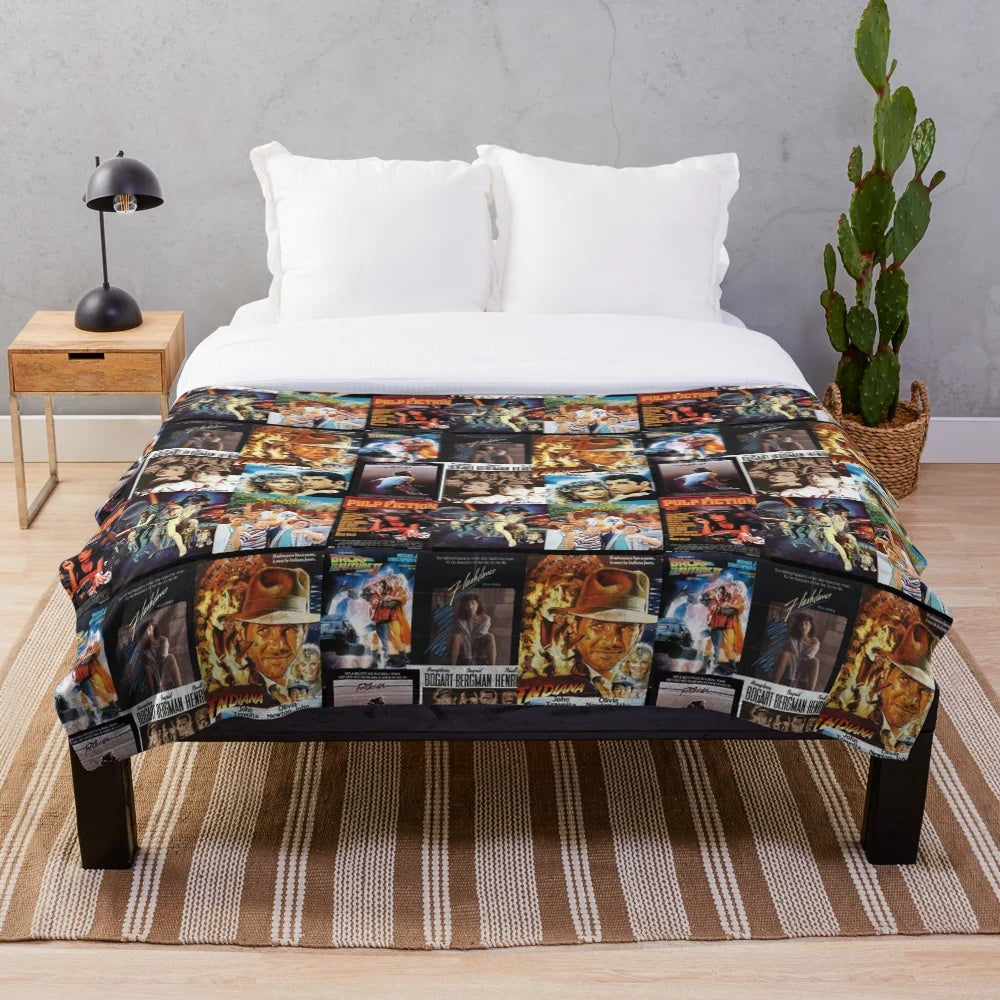 Vintage film-themed plush blanket featuring a collage of classic movie icons