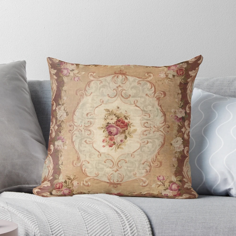 Vintage-inspired floral print pillow with an Aubusson-style design, featuring roses, daisies, and leaves in shades of brown and beige.