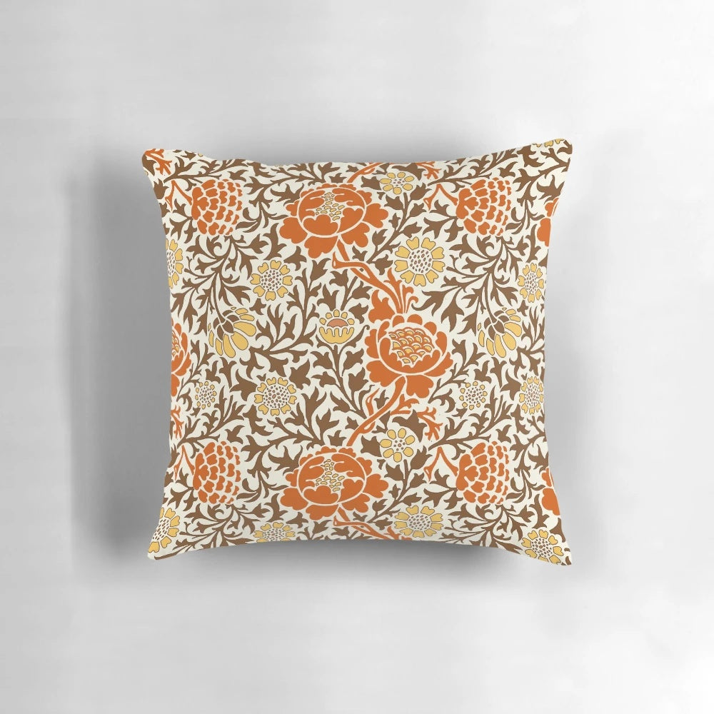 Jacobean floral wallpaper pattern featuring mandarin orange, mustard gold, and brown colors on a parchment background, printed on a decorative throw pillow.