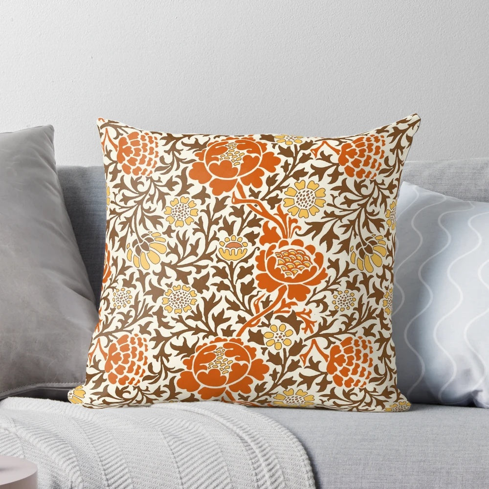 Jacobean floral wallpaper pattern featuring mandarin orange, mustard gold, and brown colors on a parchment background, printed on a decorative throw pillow.