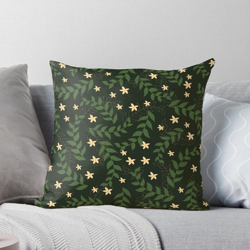 A plush, square pillow with a repeating pattern of vintage-style flowers and leaves in earthy, natural tones.