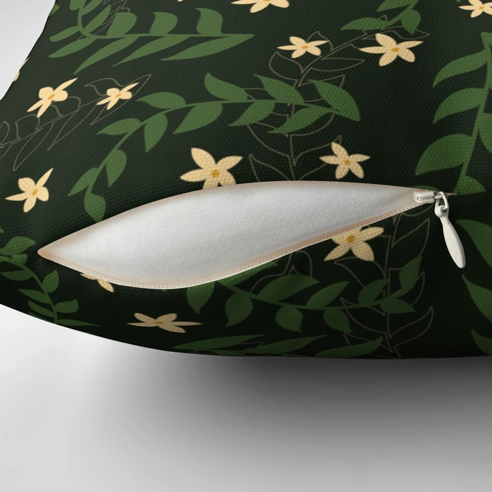 A plush, square pillow with a repeating pattern of vintage-style flowers and leaves in earthy, natural tones.