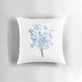 Vintage-style pillow with a hand-painted bouquet of forget-me-not flowers in shades of blue, green, and white against a neutral background.