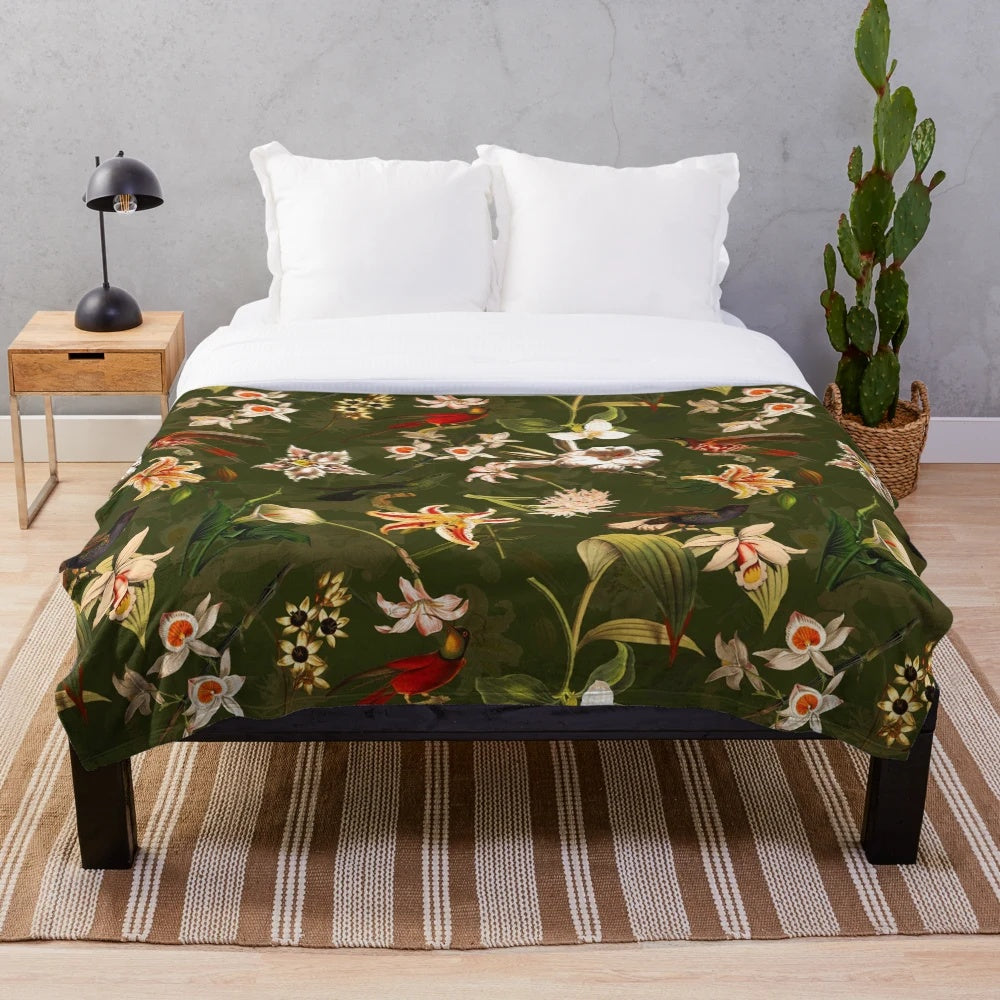 Vintage-inspired plush blanket with floral and hummingbird botanical design