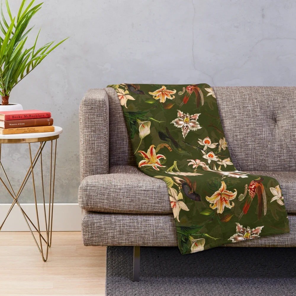Vintage-inspired plush blanket with floral and hummingbird botanical design