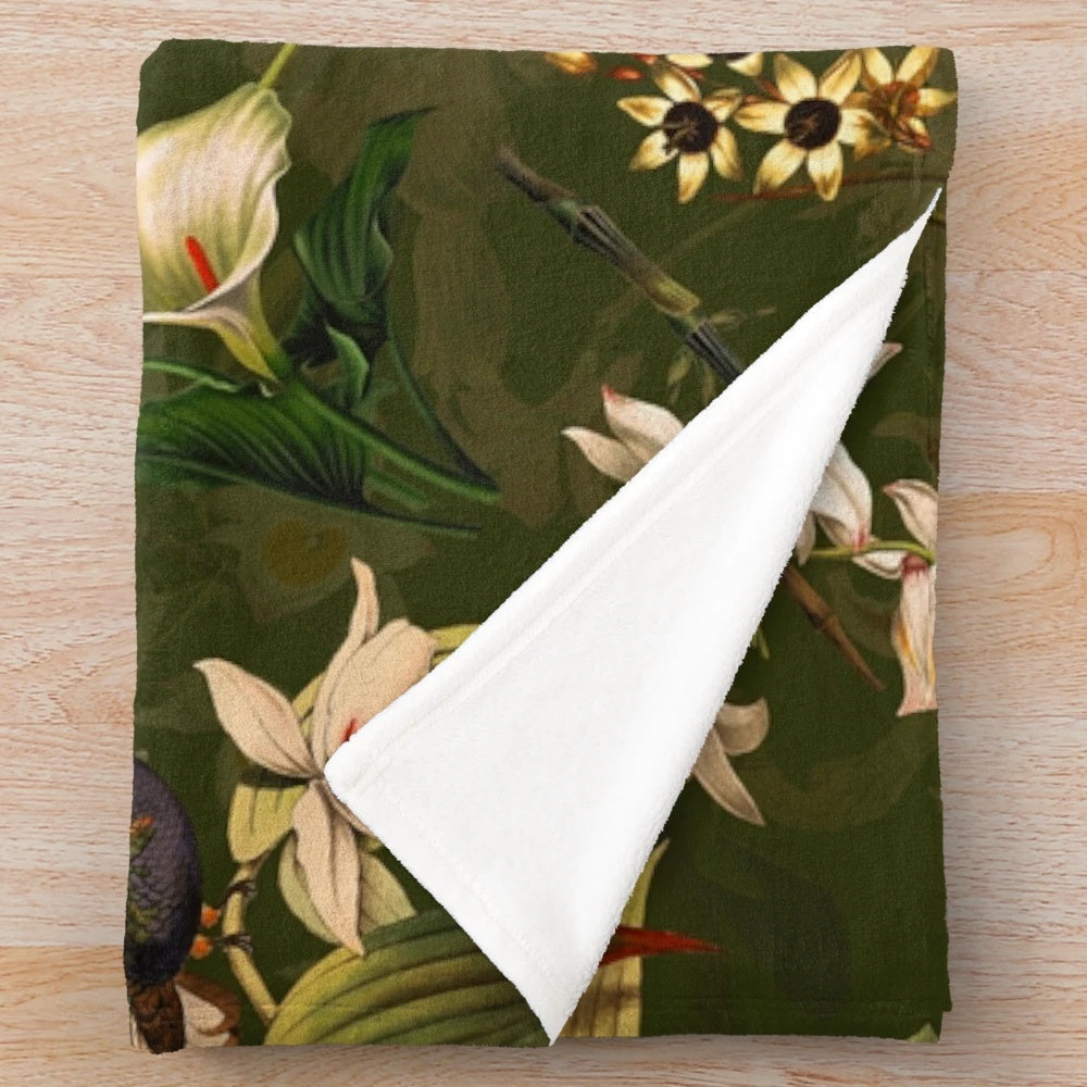 Vintage-inspired plush blanket with floral and hummingbird botanical design