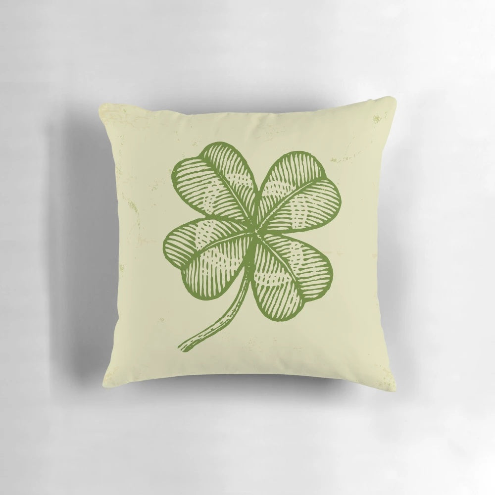 Vintage four-leaf clover pillow with a green shamrock design