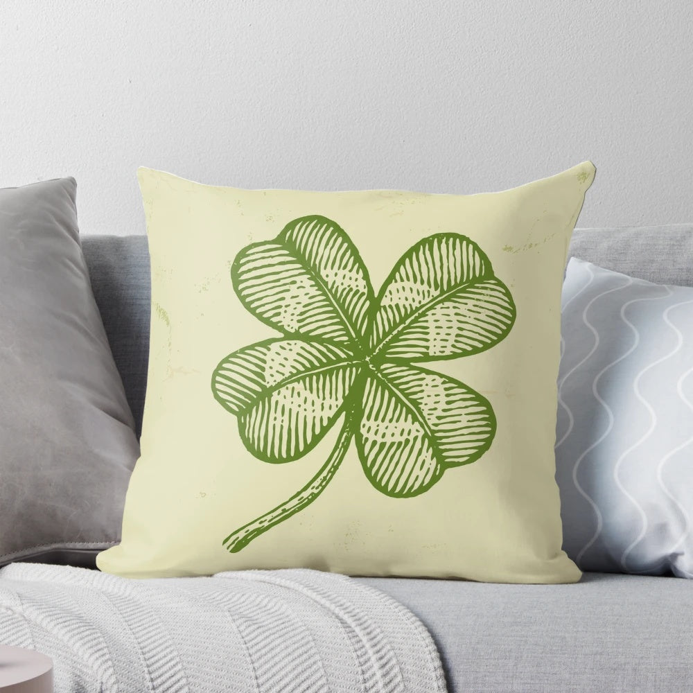 Vintage four-leaf clover pillow with a green shamrock design