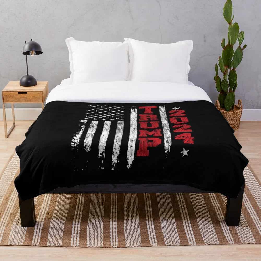 Vintage-style plush blanket featuring a Trump 2024 graphic and distressed American flag design