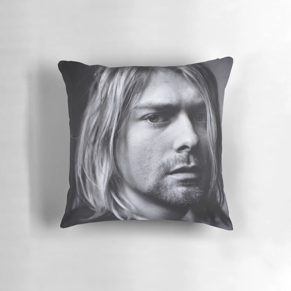 Vintage music poster pillow featuring a portrait of Kurt Cobain, the lead singer of the grunge band Nirvana.