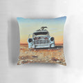 Vibrant pillow featuring a colorful, whimsical painting of an old Holden car in the Australian outback