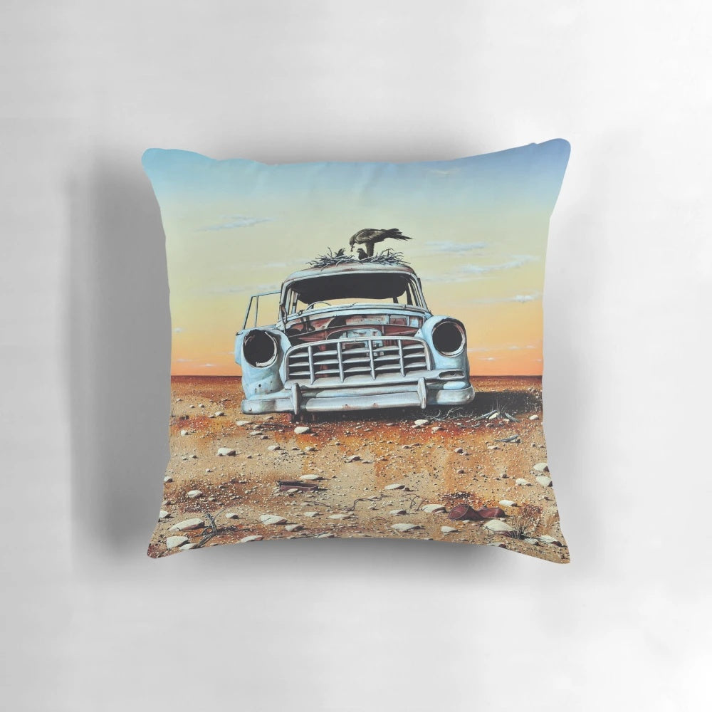 Vibrant pillow featuring a colorful, whimsical painting of an old Holden car in the Australian outback