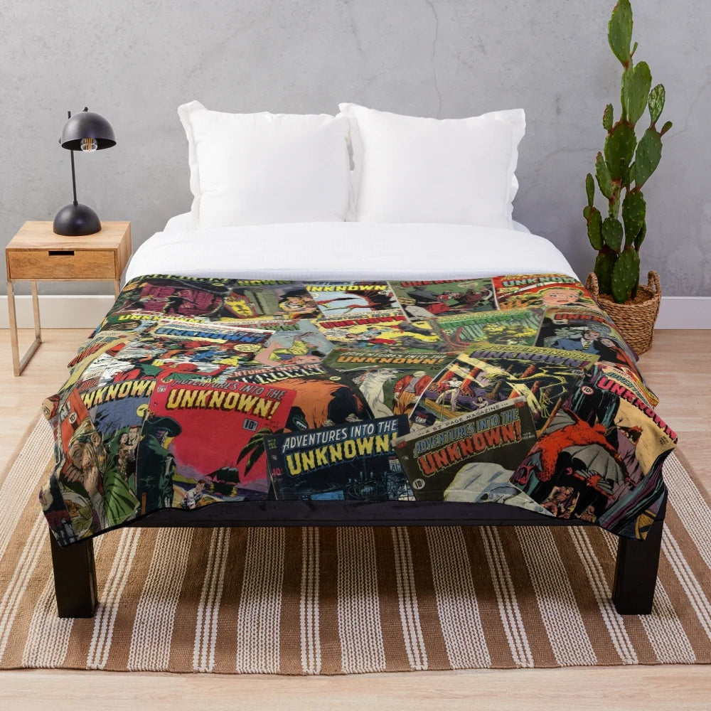 Vintage comic book style plush blanket featuring spooky monster illustrations and "Adventure Into the Unknown" design