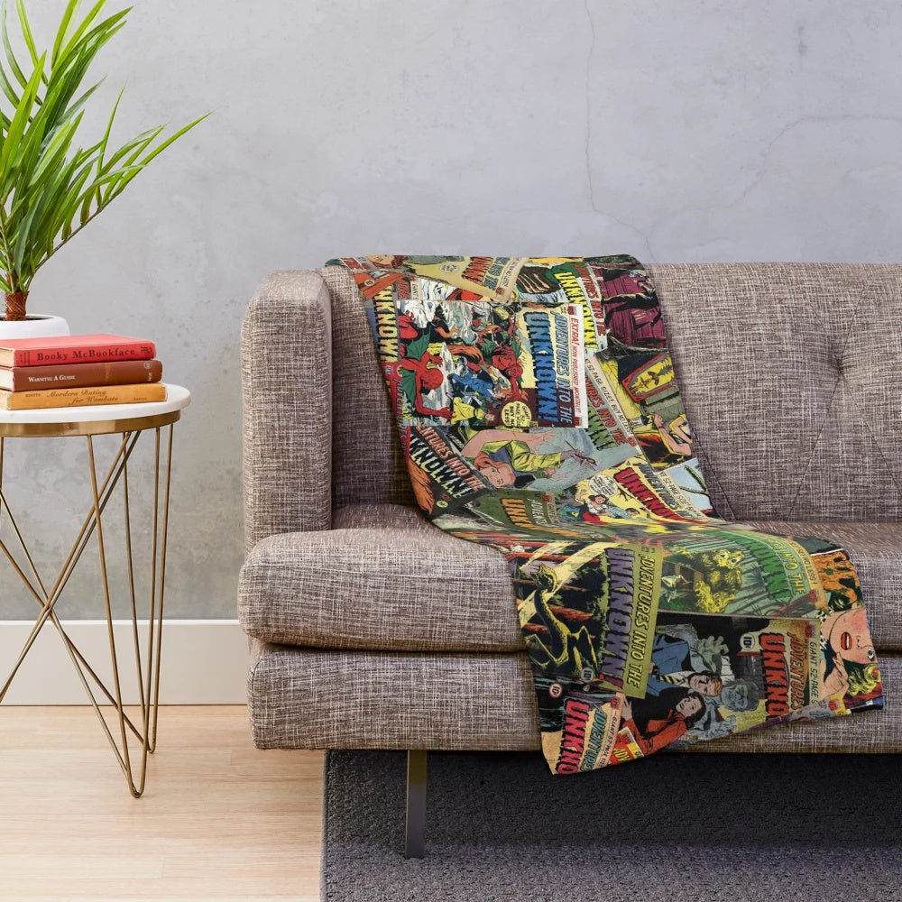 Vintage comic book style plush blanket featuring spooky monster illustrations and "Adventure Into the Unknown" design