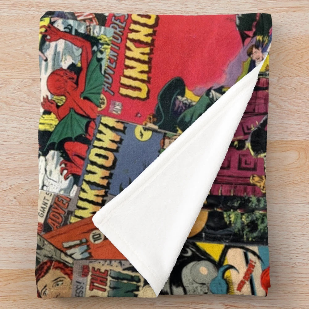 Vintage comic book style plush blanket featuring spooky monster illustrations and "Adventure Into the Unknown" design