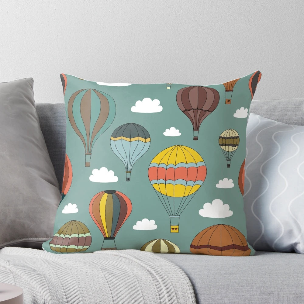 Vintage-style hot air balloon illustration on a decorative pillow