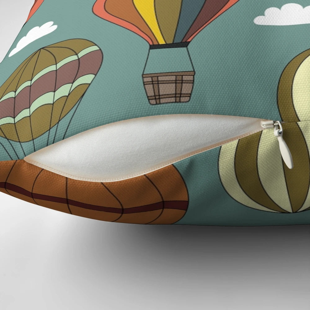 Vintage-style hot air balloon illustration on a decorative pillow