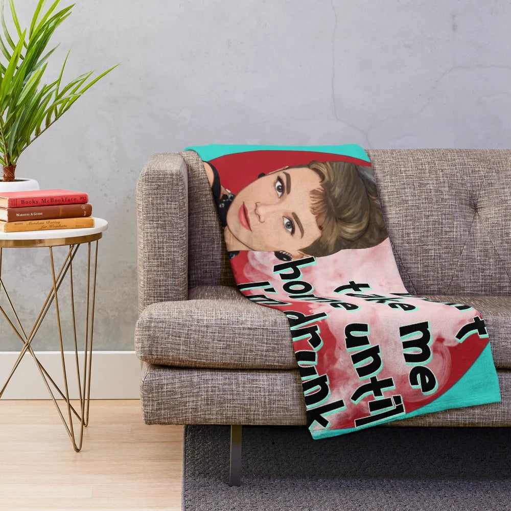 Plush blanket featuring an image of Audrey Hepburn from the classic film Breakfast at Tiffany's