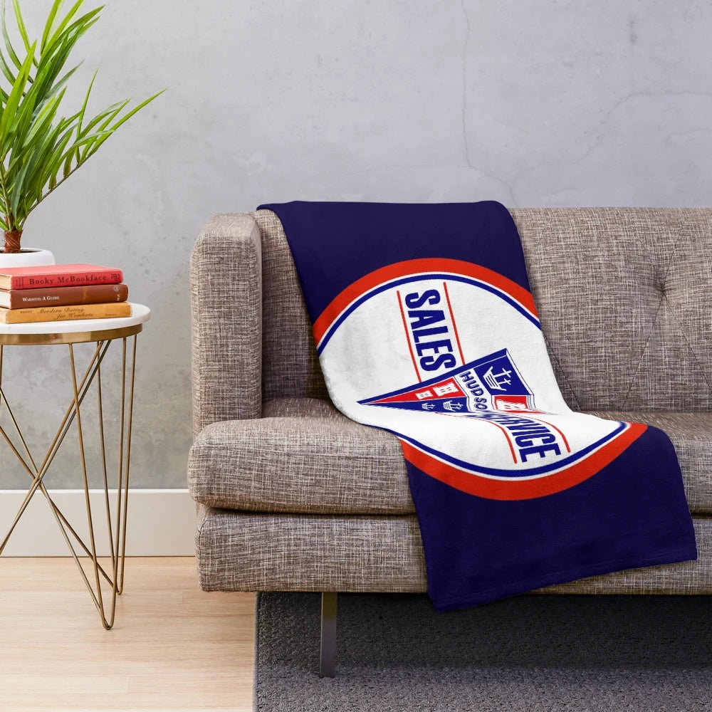 Vintage-inspired plush blanket featuring the Hudson Sales and Service logo