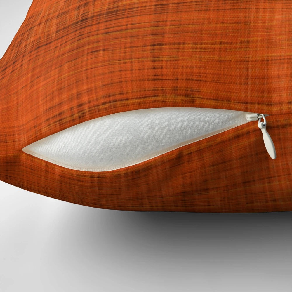 Vintage-inspired orange barkcloth pillow with a retro mid-century modern aesthetic.