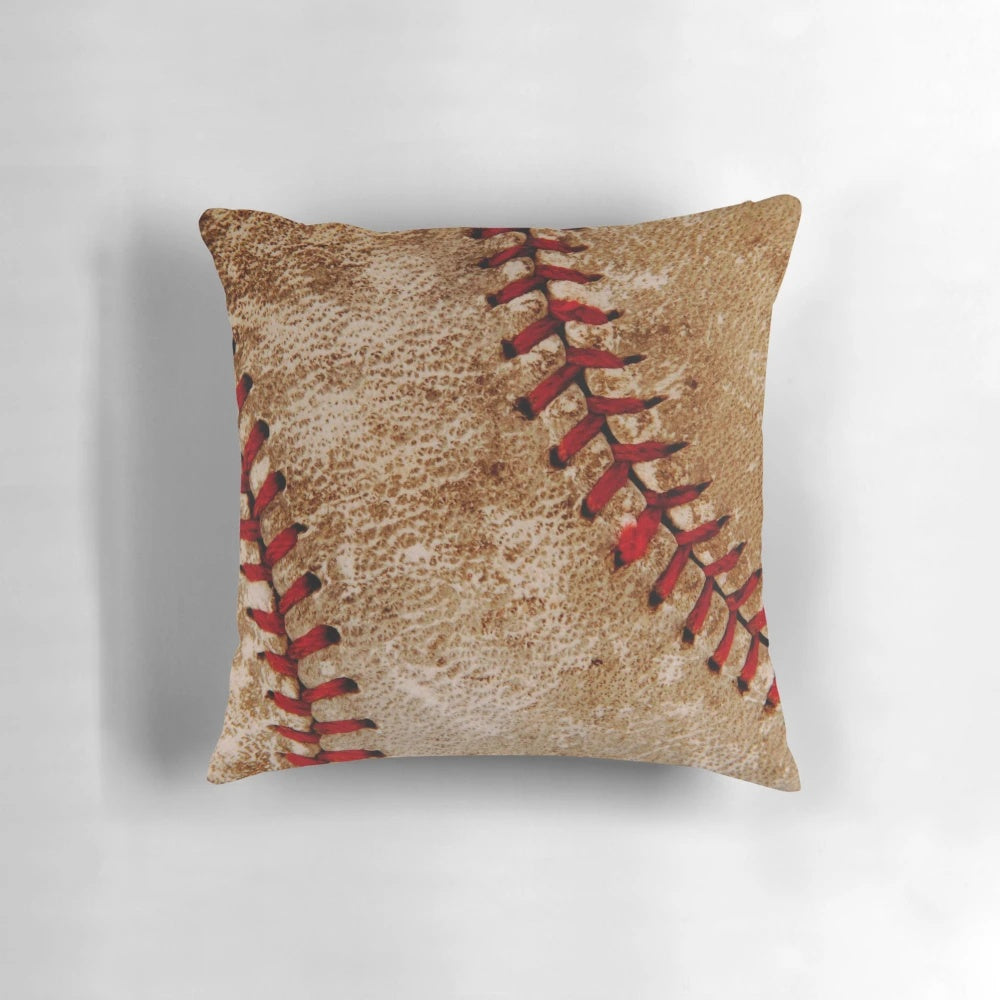 Vintage-style red and white baseball-themed throw pillow with stitching details