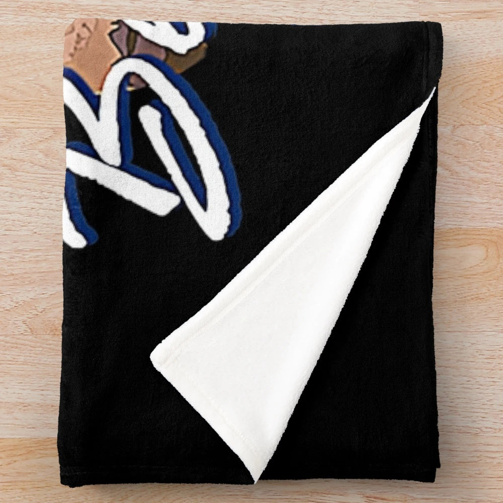 Vintage-inspired plush blanket with "Be Nice" text and 80s movie-inspired design