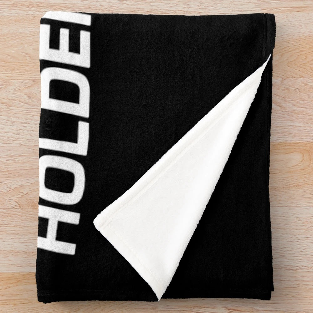 Vintage-inspired black plush blanket with Holden Racing Team design