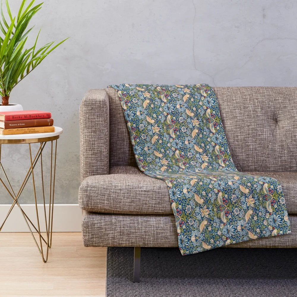 Blue and gold plush blanket with vintage-inspired 'Strawberry Thief' pattern