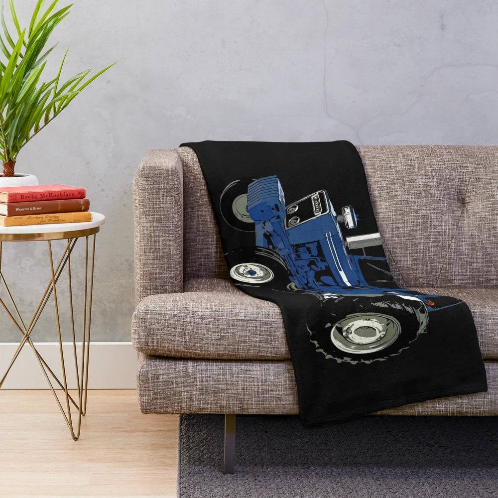 Cozy plush blanket featuring an old blue ford tractor in a rural landscape