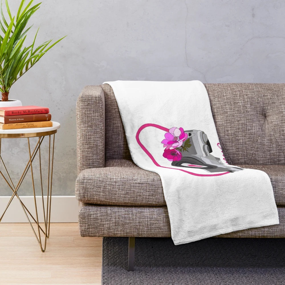 Vintage-inspired camera plush blanket with floral and heart designs