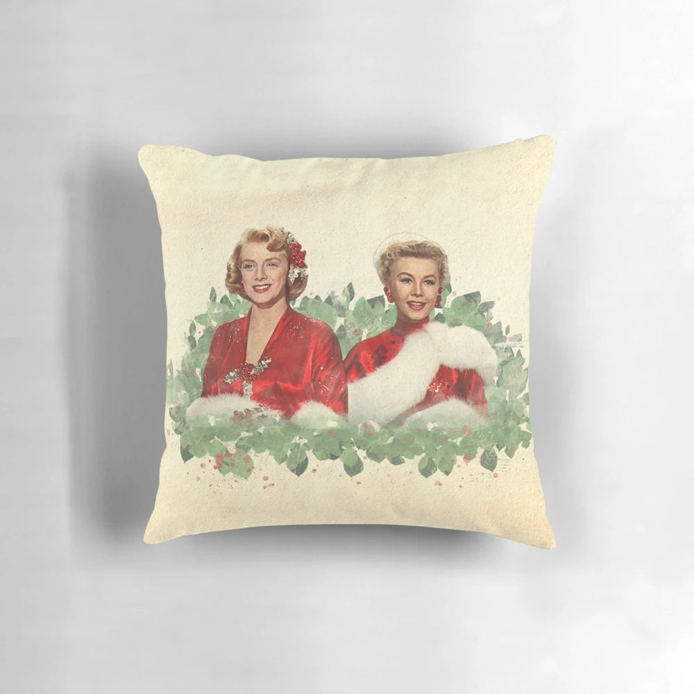 Vintage-style Christmas pillow with classic film characters and blue, white, and feather design