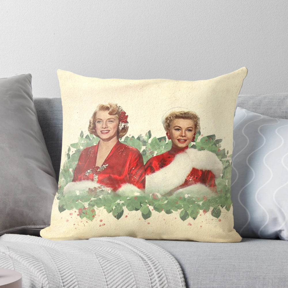 Vintage-style Christmas pillow with classic film characters and blue, white, and feather design