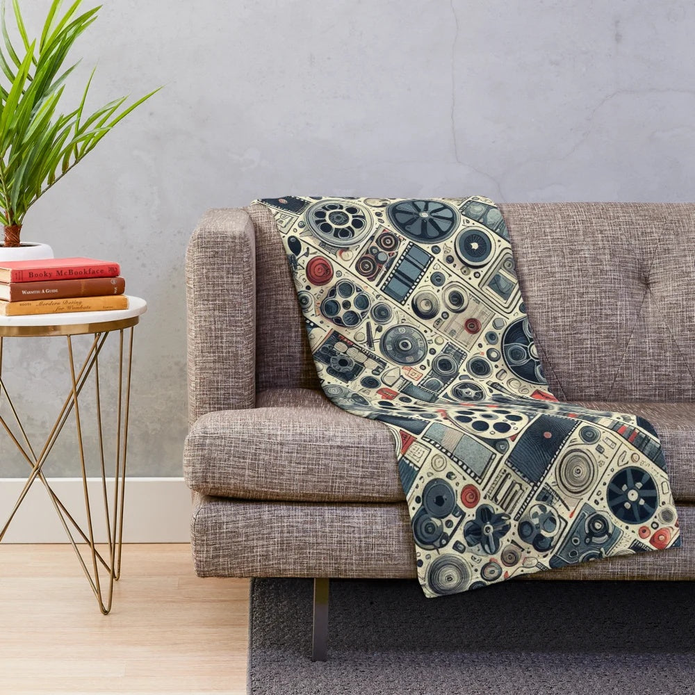 Vintage-inspired cinema plush blanket with scrolls, camera, and movie elements