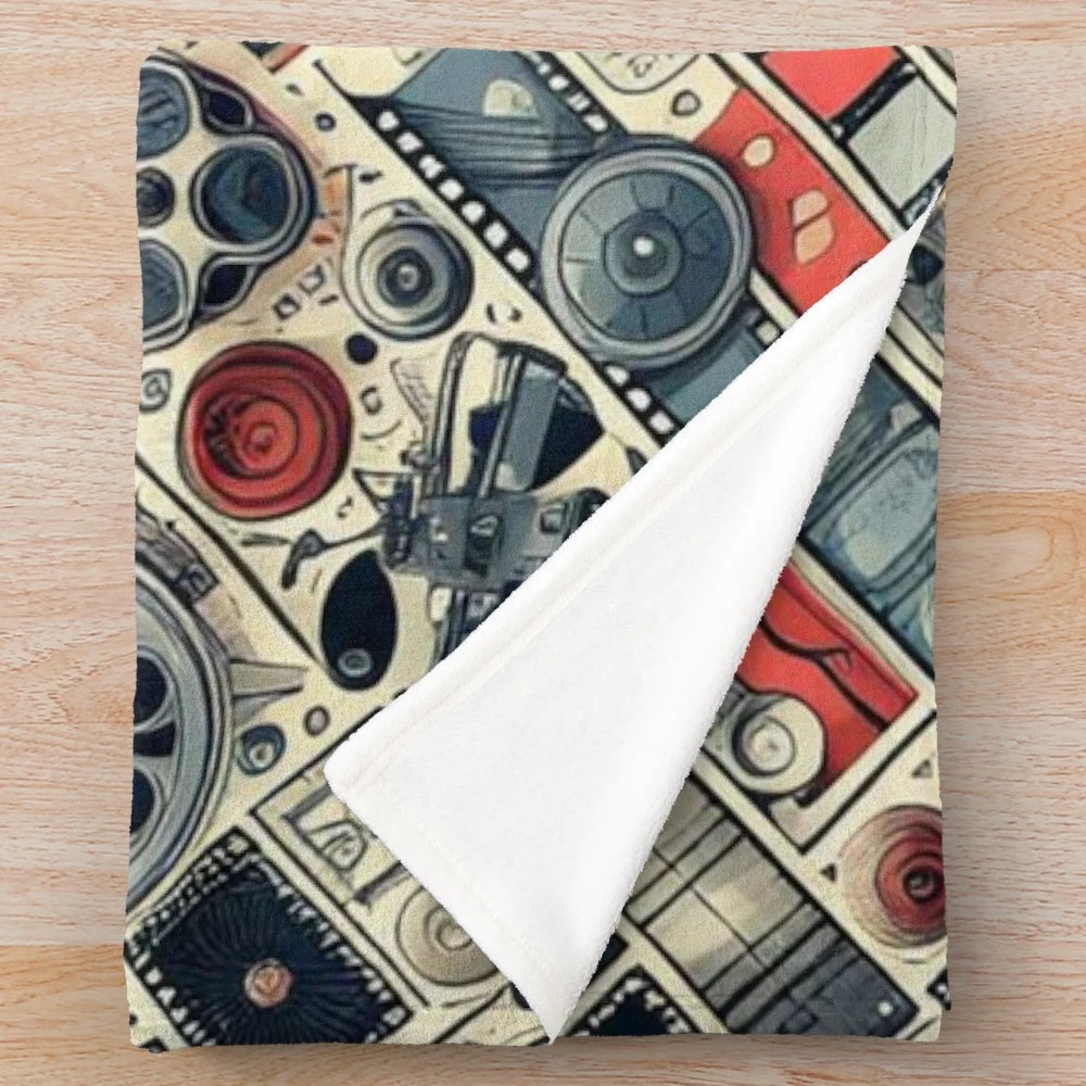 Vintage-inspired cinema plush blanket with scrolls, camera, and movie elements