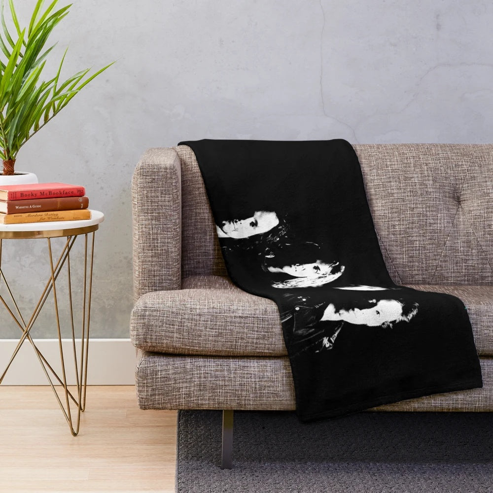 Vintage-inspired plush blanket with classic rock band design