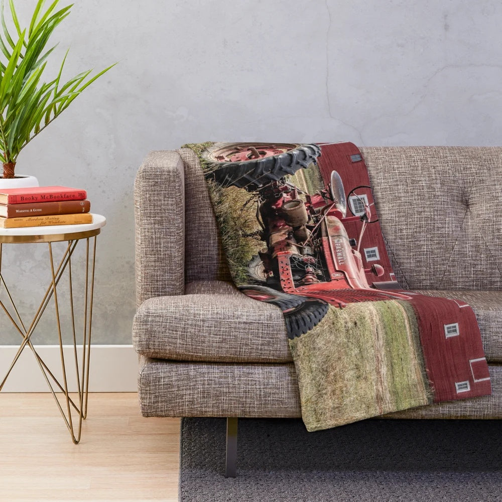 Cozy plush blanket featuring a vintage red Farmall tractor