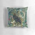 Vintage-style green floral pillow with a raven perched on acanthus leaves, creating a nature-inspired, elegant design.