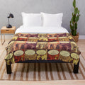Plush blanket featuring vintage book covers of Jane Austen's classic novels